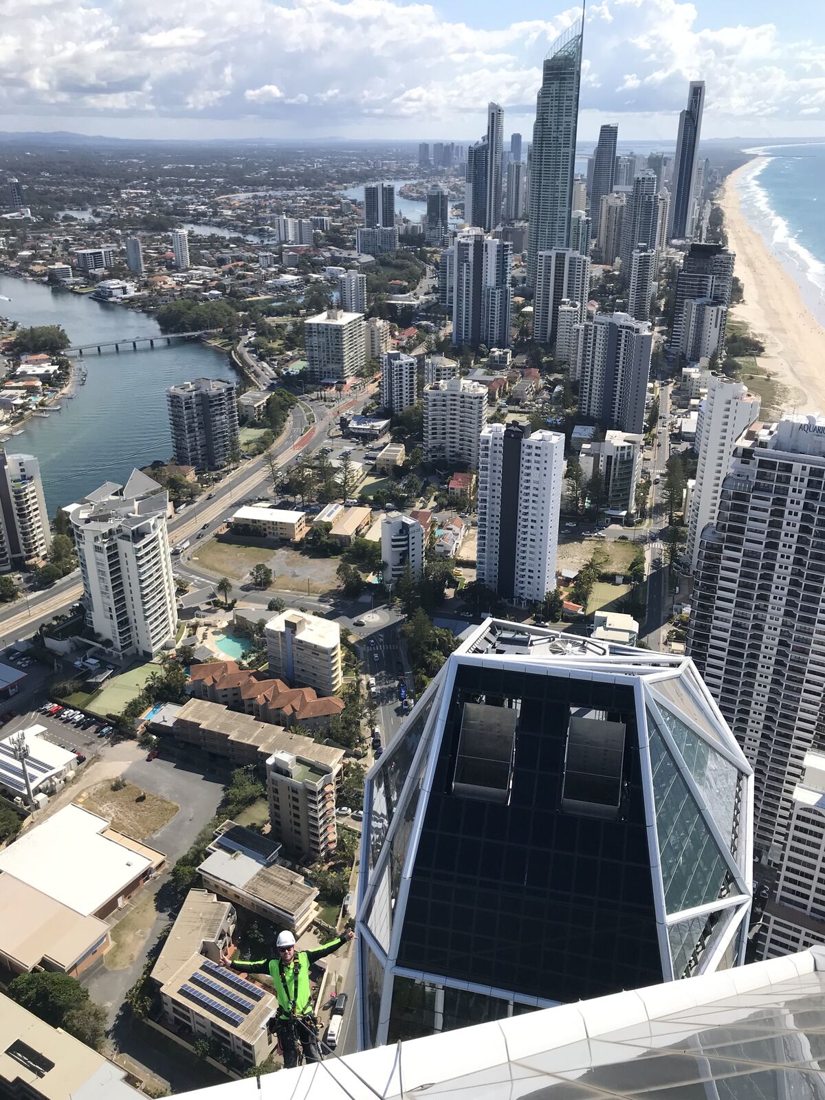 Tradies on Ropes technician at the Jewel rooftop overlooking Surfers Paradise skyline